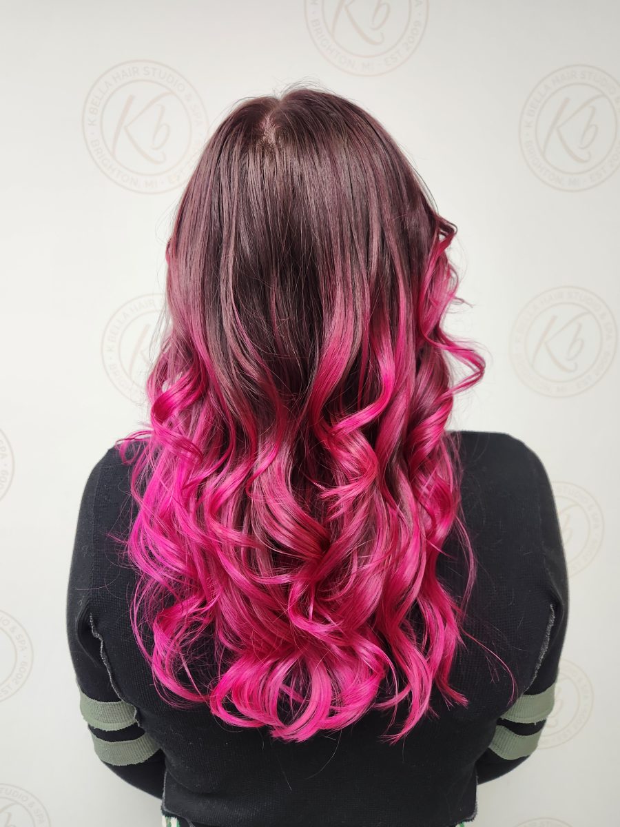 Sun-kissed balayage highlights accented with vivid color by Siobhan Rozinski at K Bella Hair Studio in Brighton, MI - after transformation
