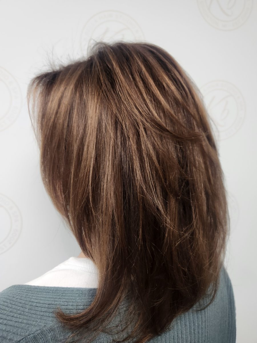 After photo: layered cut with dimensional chocolate and caramel tones, back three-quarter view by Siobhan Rozinski at K Bella Hair Studio & Spa in Brighton, MI