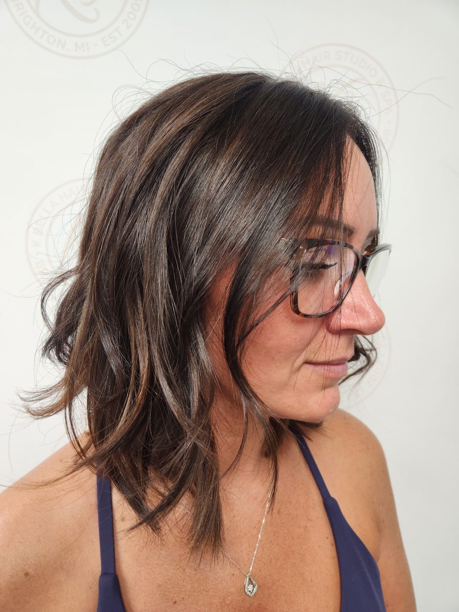 Dimensional highlights and lowlights with fresh root touch-up by Siobhan Rozinski at K Bella Hair Studio & Spa in Brighton, MI