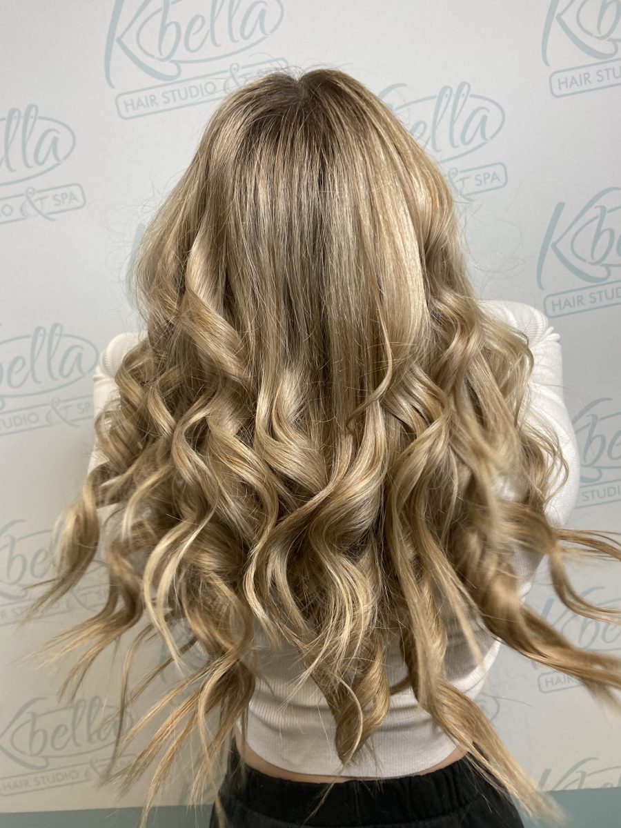 Seamless hair extensions adding length and volume by Kameryn Bell at K Bella Hair Studio in Brighton, MI - after transformation