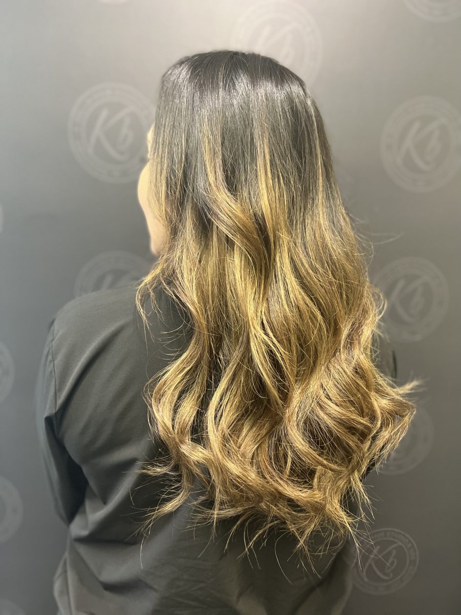Sun-kissed balayage highlights by Raquel Vettese at K Bella Hair Studio in Brighton, MI