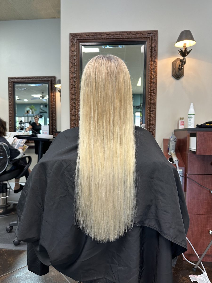 Seamless hair extensions adding length and volume by Kameryn Bell at K Bella Hair Studio in Brighton, MI - after transformation