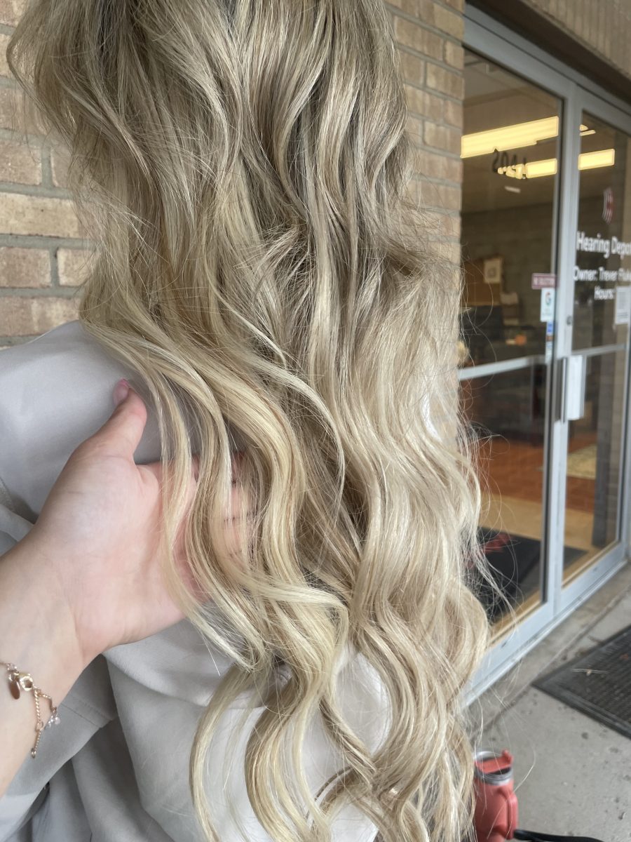 Seamless hair extensions adding length and volume by Kristan Sayers at K Bella Hair Studio in Brighton, MI