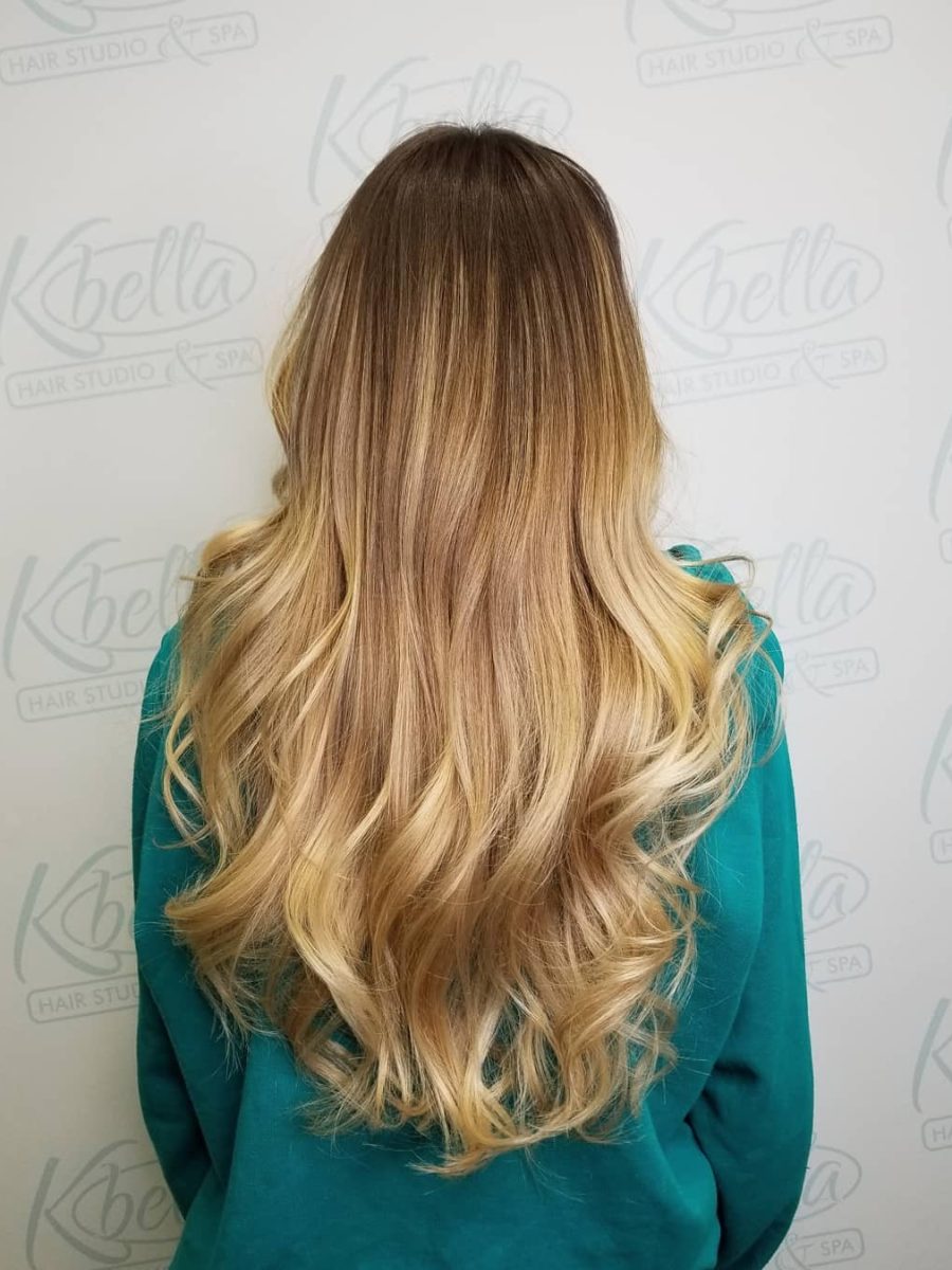 Sun-kissed balayage highlights by Kristan Sayers at K Bella Hair Studio in Brighton, MI