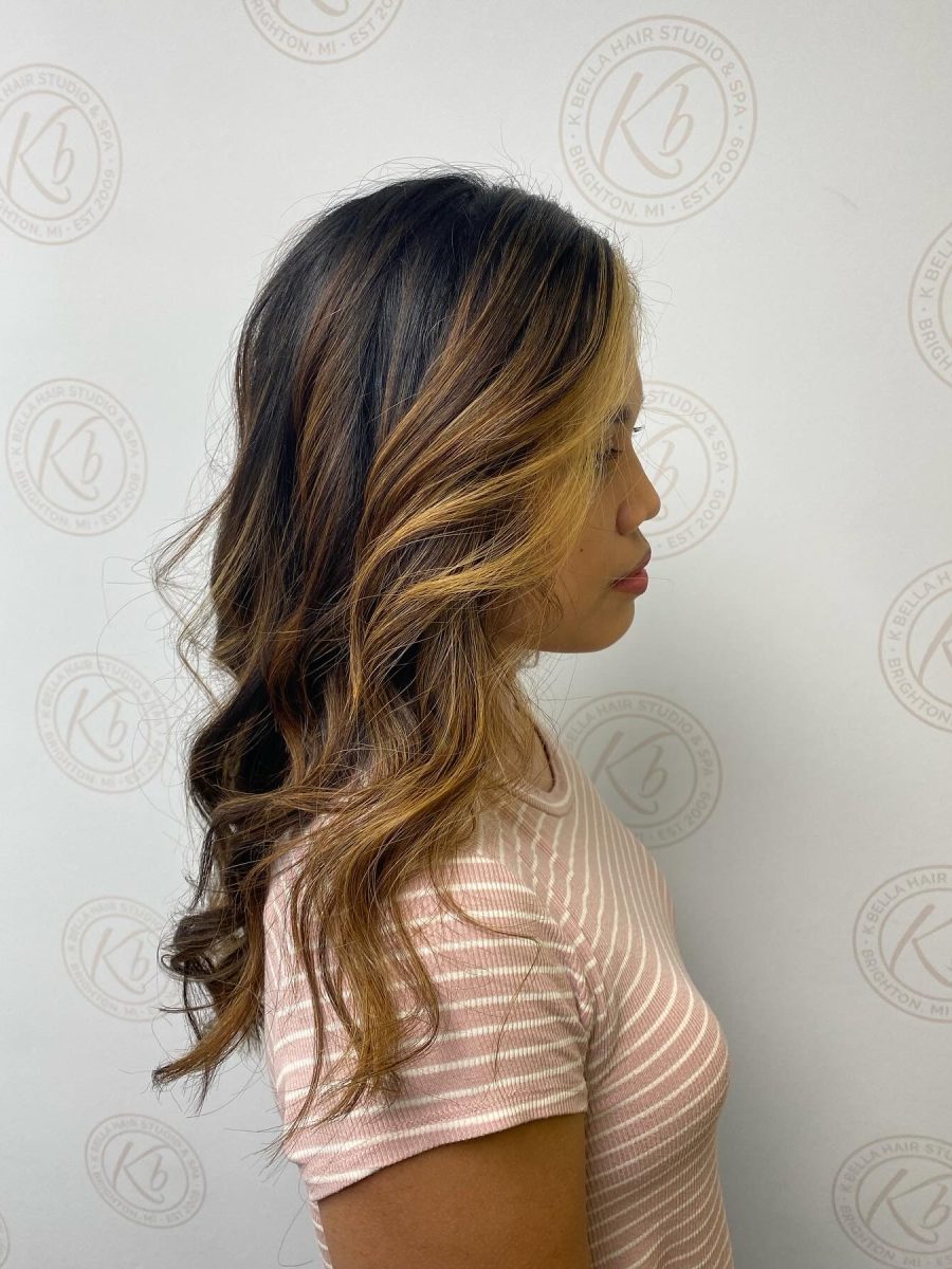 Sun-kissed balayage highlights by Abbey French at K Bella Hair Studio in Brighton, MI