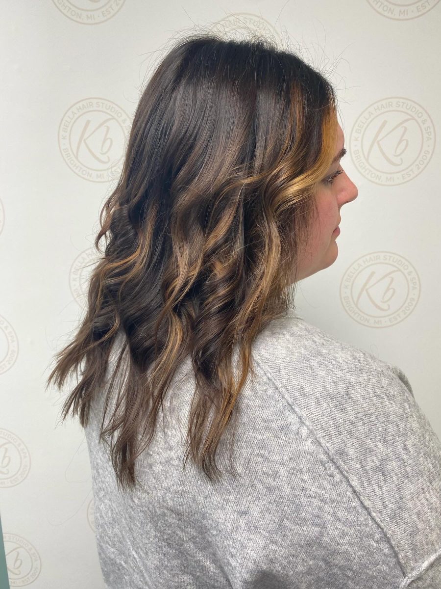 Sun-kissed balayage highlights by Abbey French at K Bella Hair Studio in Brighton, MI