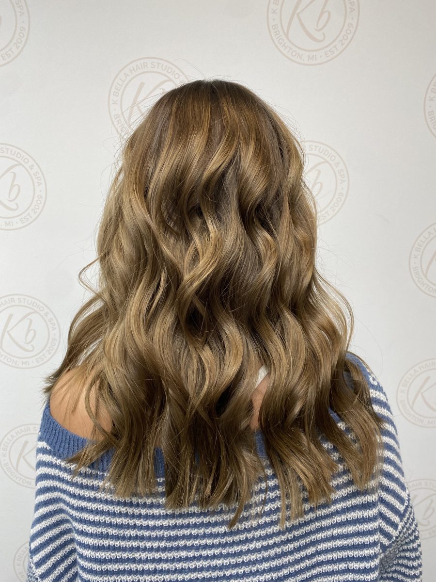 Sun-kissed balayage highlights by Abbey French at K Bella Hair Studio in Brighton, MI