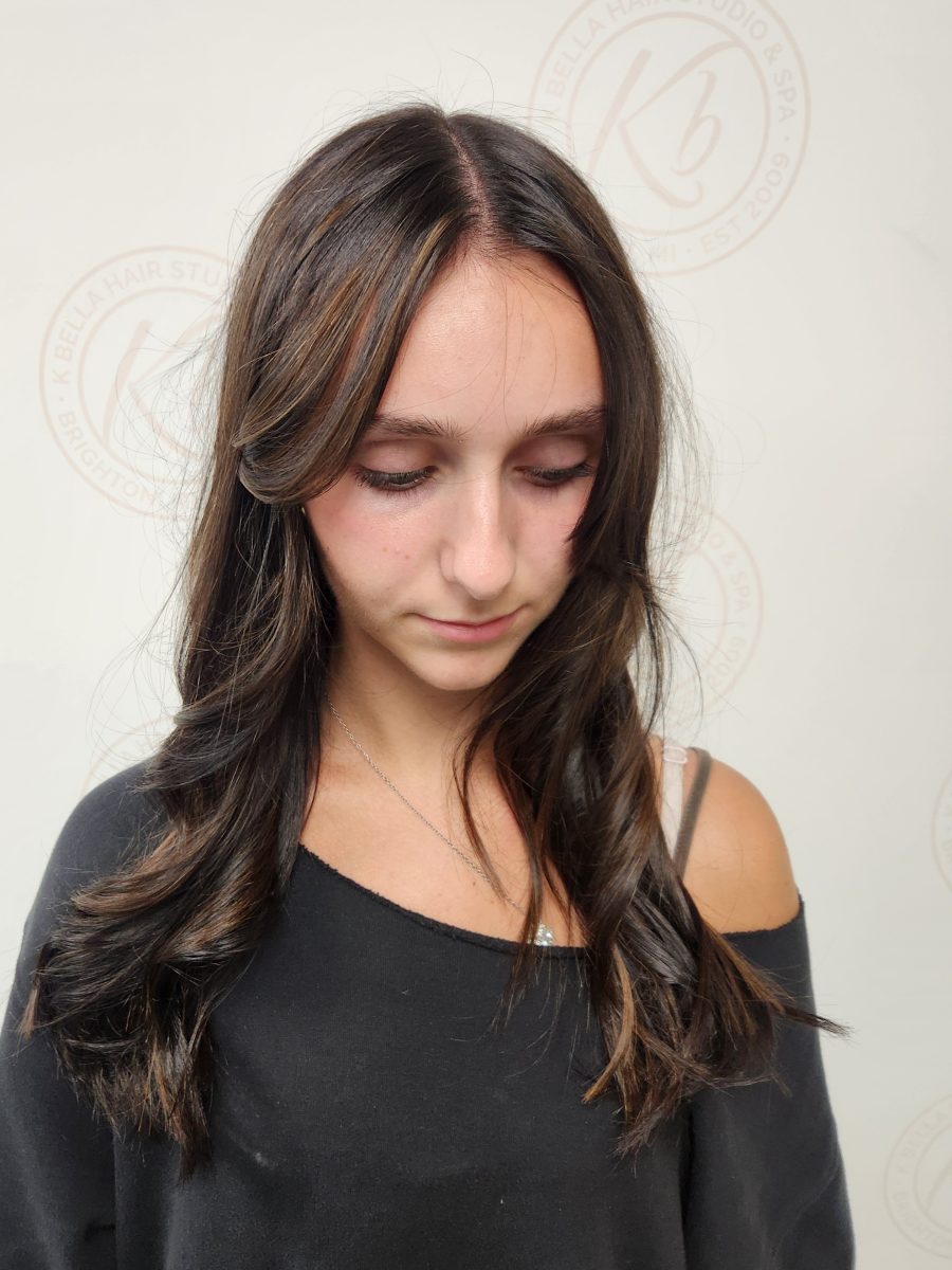 Sun-kissed balayage highlights by Siobhan Rozinski at K Bella Hair Studio in Brighton, MI