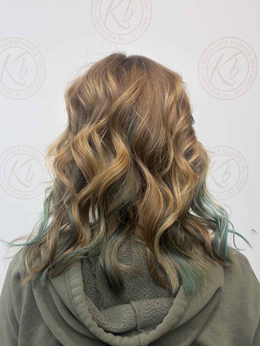 Dimensional highlights and lowlights accented with vivid color by Abbey French at K Bella Hair Studio in Brighton, MI