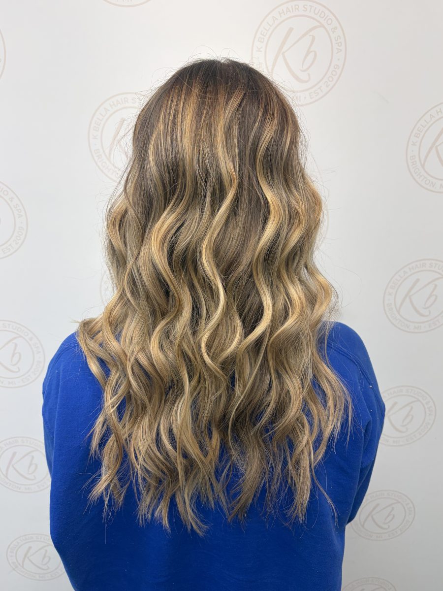 Sun-kissed balayage highlights by Abbey French at K Bella Hair Studio in Brighton, MI