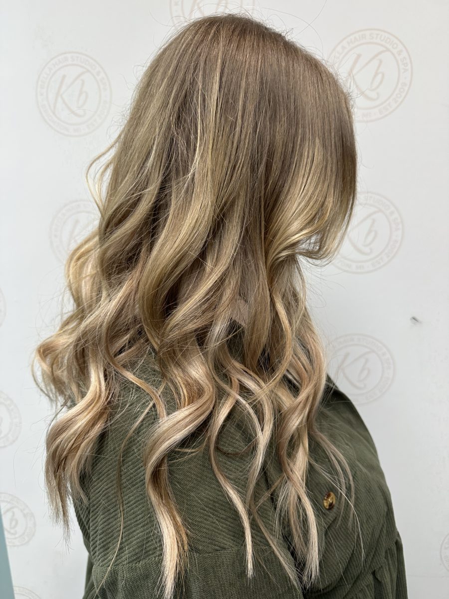 Seamless hair extensions adding length and volume by Liberty Greenwood at K Bella Hair Studio & Spa in Brighton, MI