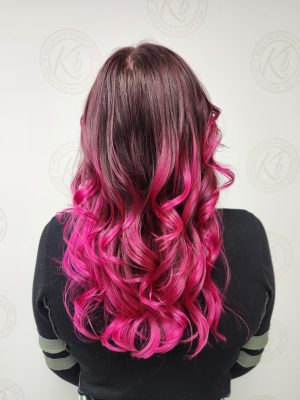 Sun-kissed balayage highlights accented with vivid color by Siobhan Rozinski at K Bella Hair Studio in Brighton, MI - after transformation