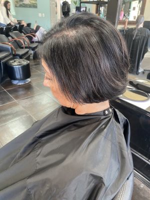 Seamless hair extensions adding length and volume with a fresh cut by Abbey French at K Bella Hair Studio in Brighton, MI